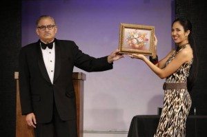 Brian Jaffe and Elaine Baez in "Going Once! Laughing Twice!!" Photo by Carol Rosegg.