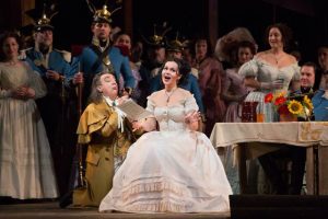 Alessandro Corbelli as Dulcamara and Aleksandra Kurzak as Adina in Donizetti’s L’Elisir d’Amore. Photo: Marty Sohl/Metropolitan Opera