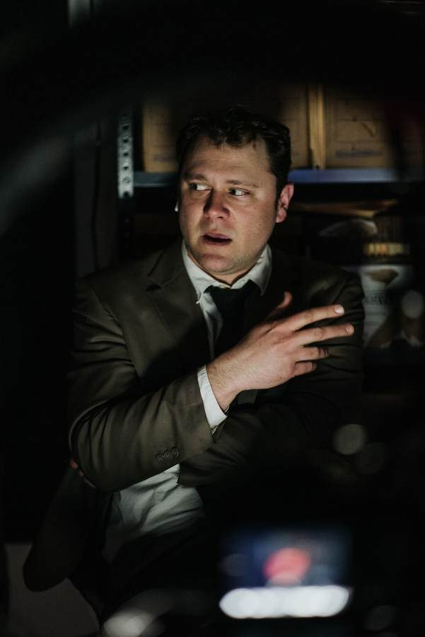 photo of Michael Guagno sitting at a desk